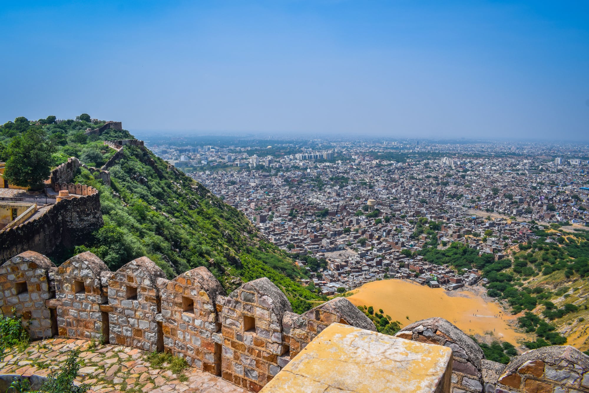The old city wall snaking over the hills above Jaipur