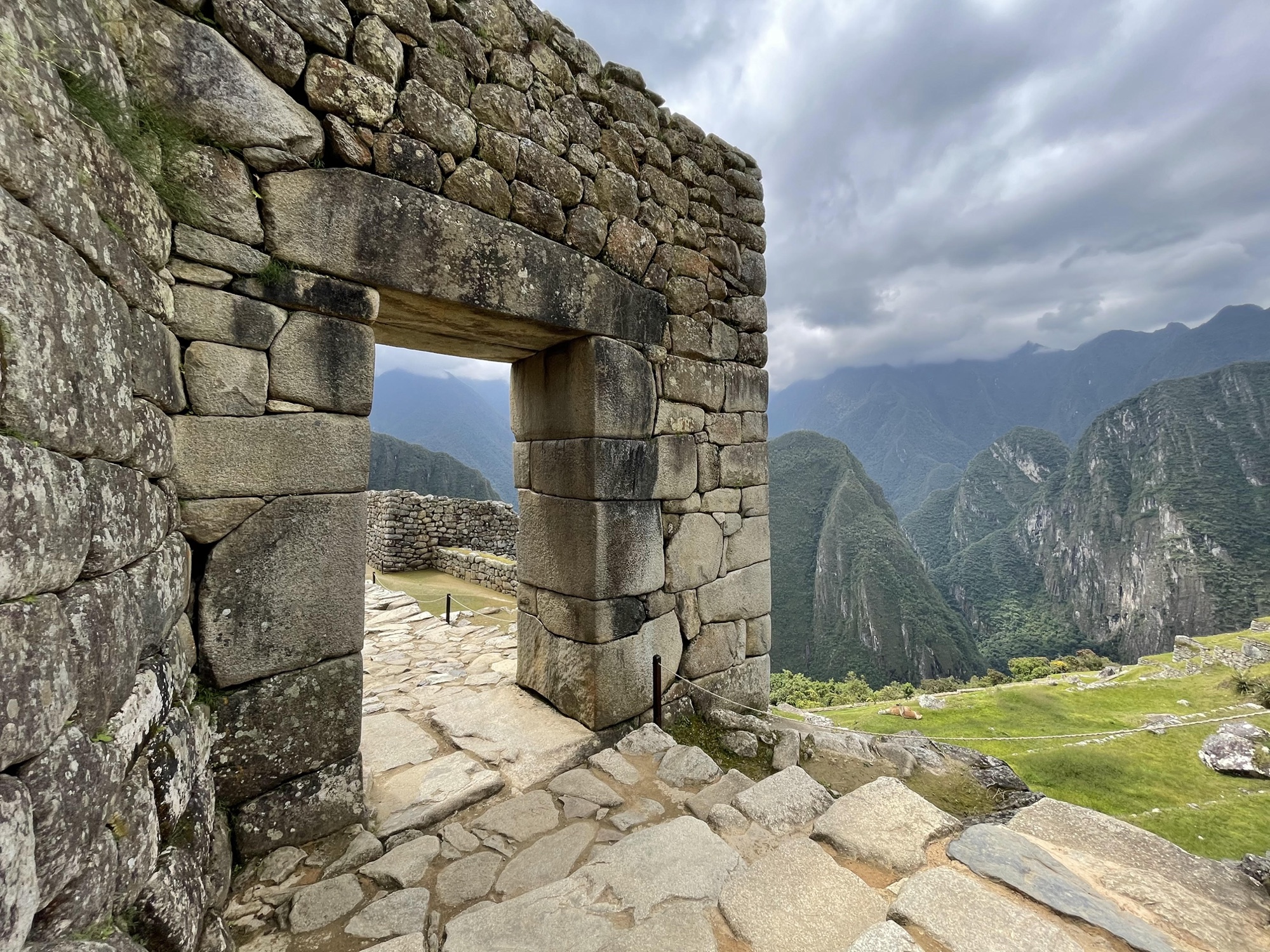 A stone doorway at Machu Picchu framing the mountains beyond