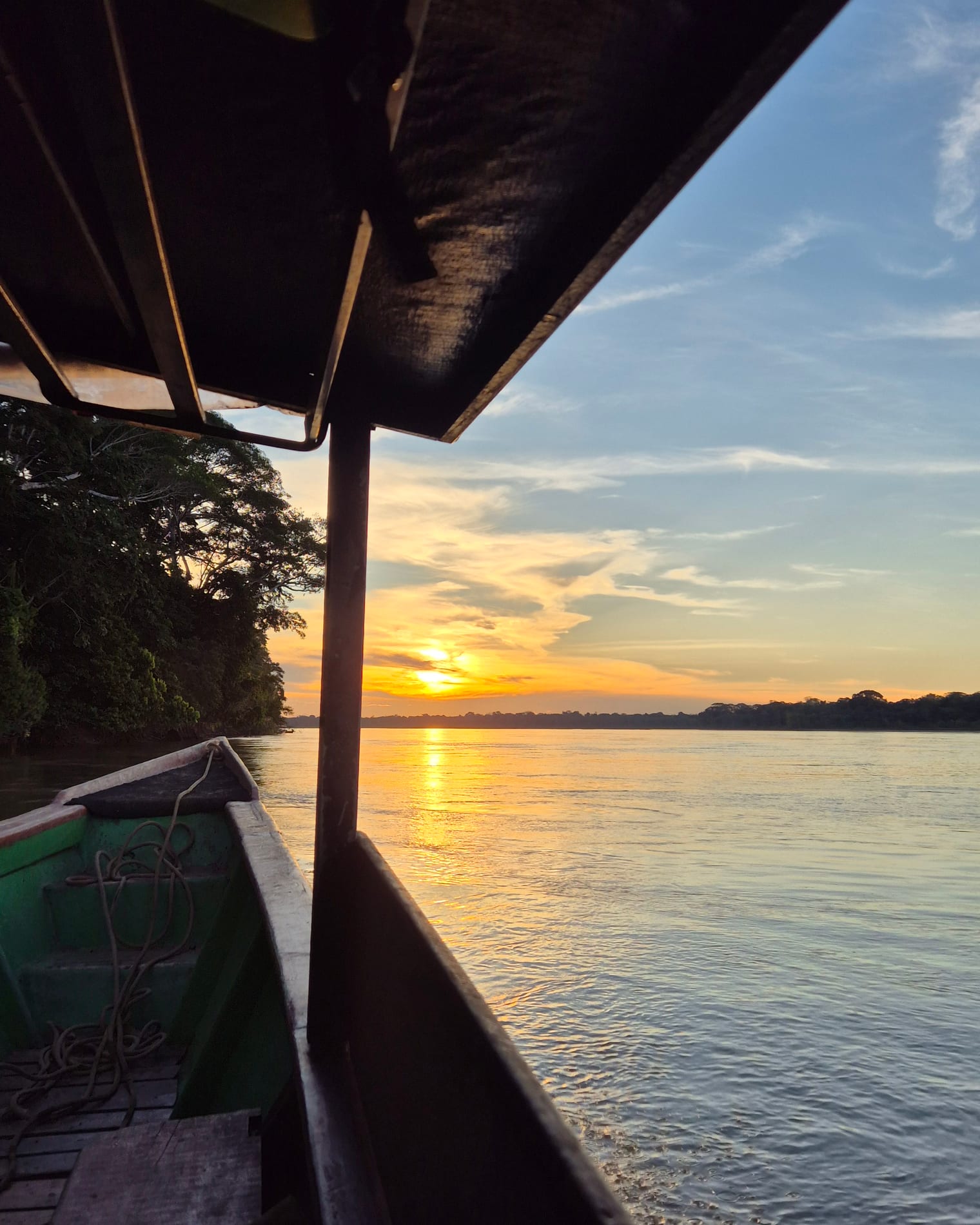 Sunset on the Tambopata river from the lodge boat