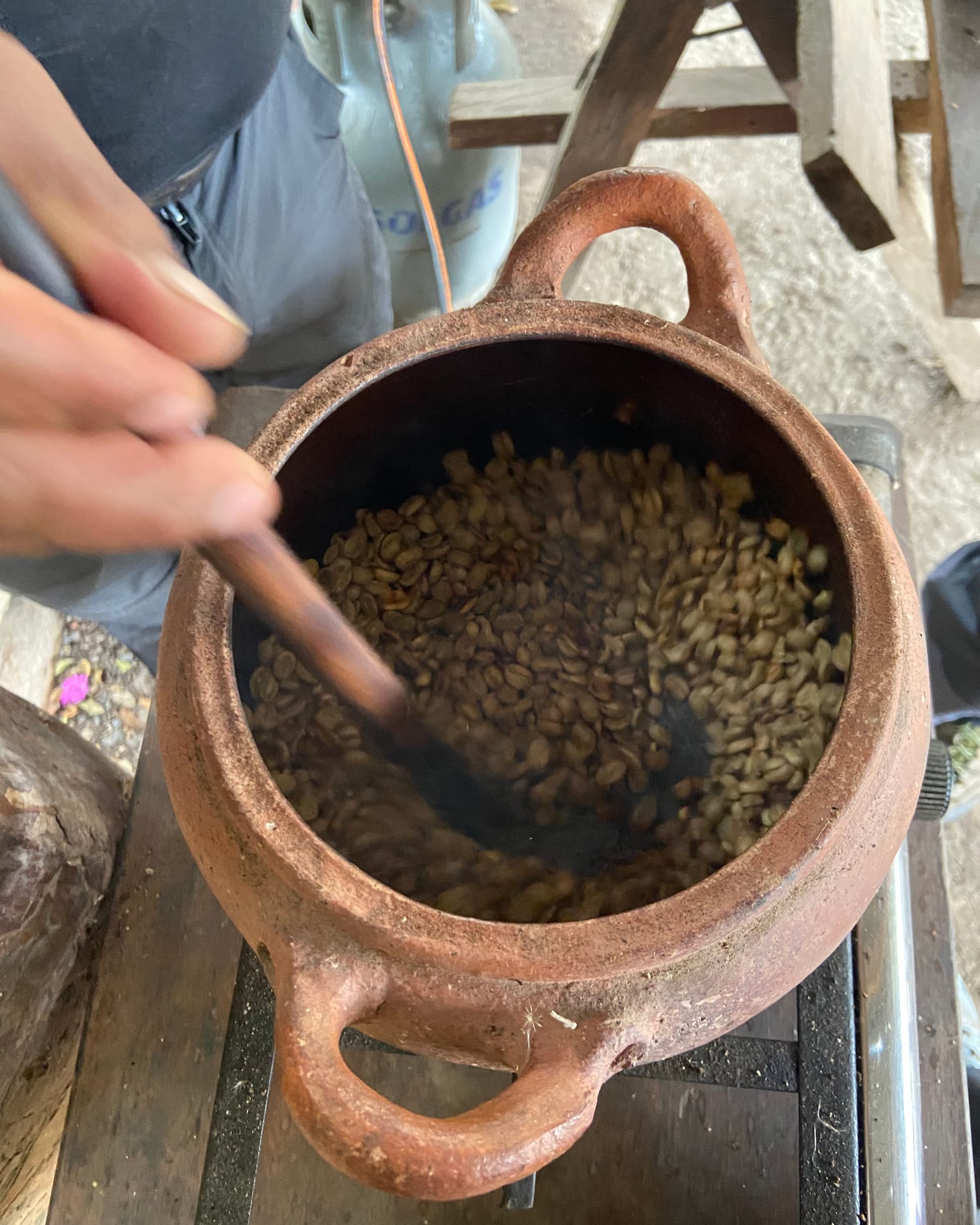Roasting coffee in a clay pot on Alejandro’s farm